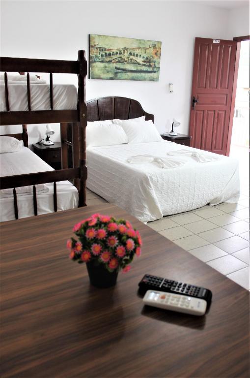 Cama ou camas em um quarto em Hotel Bela Onda