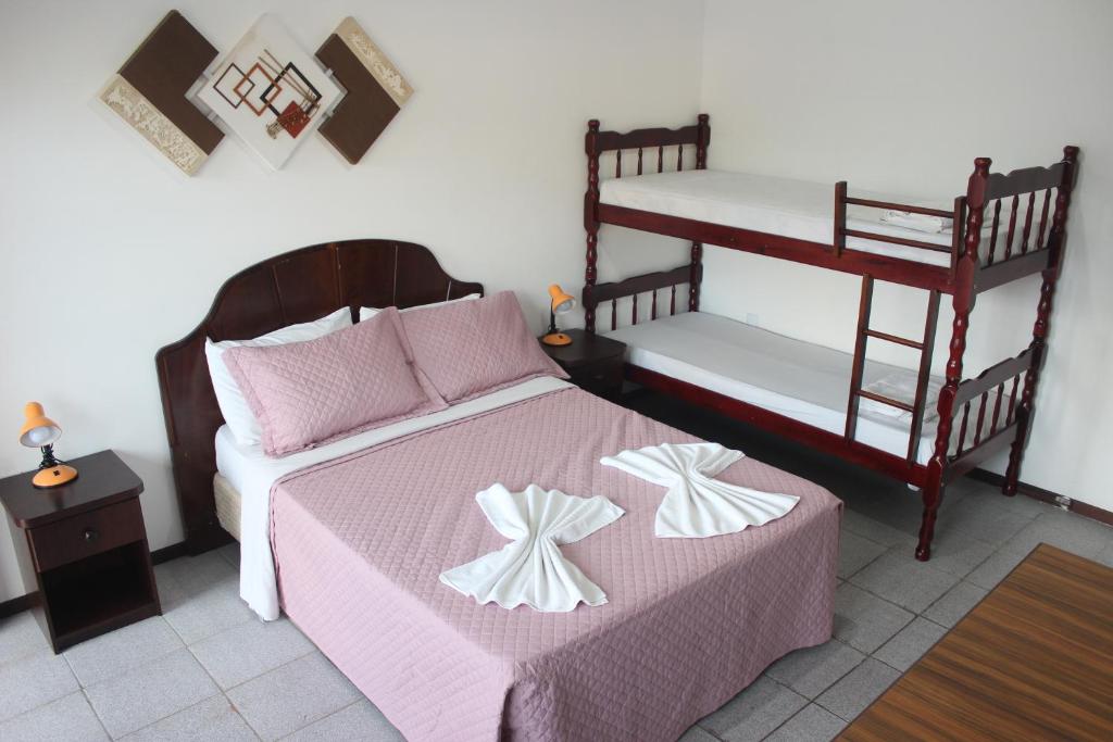 Cama ou camas em um quarto em Hotel Bela Onda
