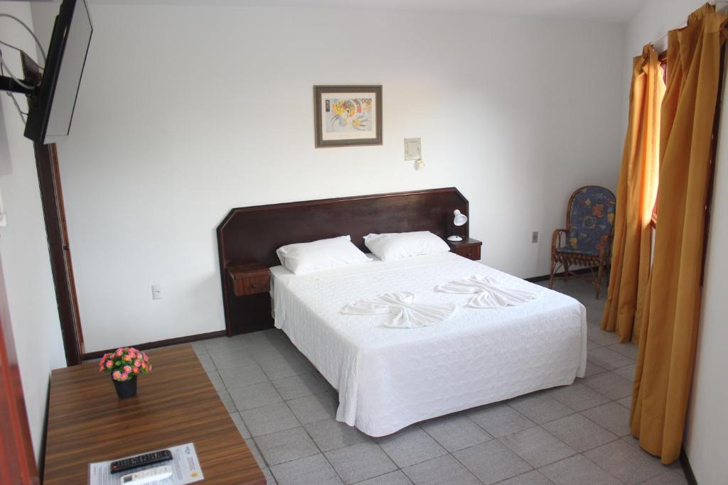 Cama ou camas em um quarto em Hotel Bela Onda