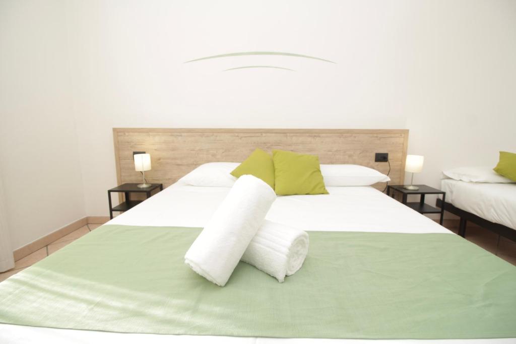 Postel nebo postele na pokoji v ubytování Hotel Tornielli 9 by LVG Hotel Collection