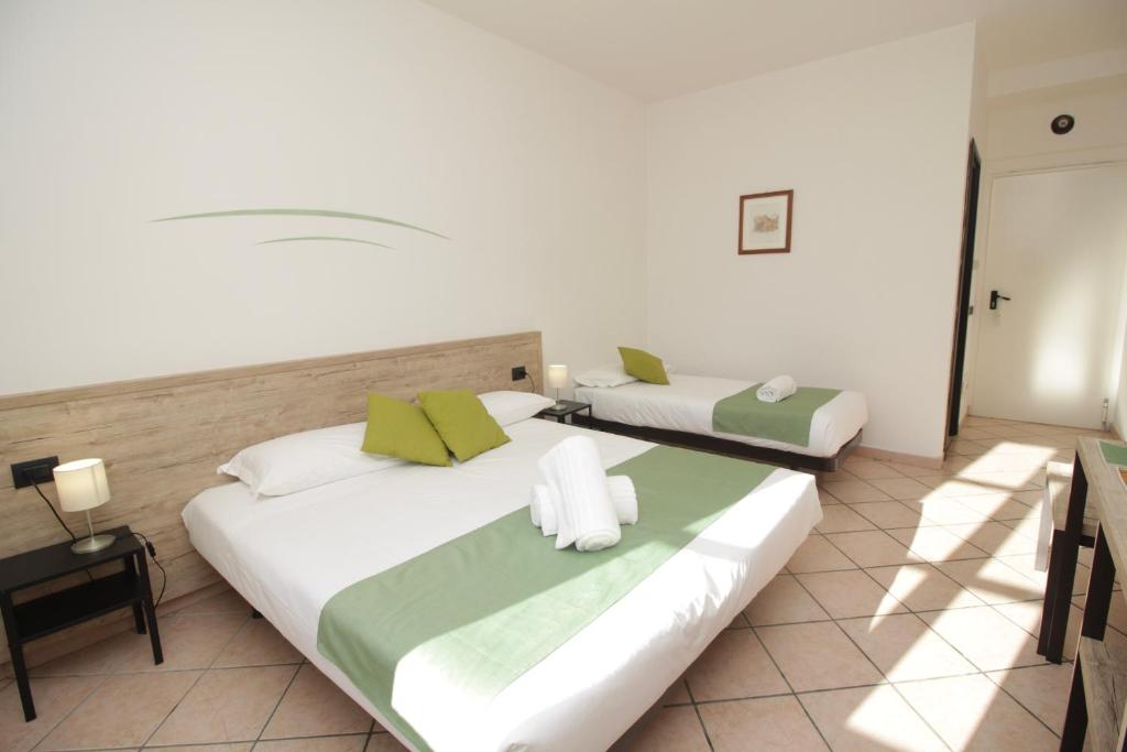 Postel nebo postele na pokoji v ubytování Hotel Tornielli 9 by LVG Hotel Collection