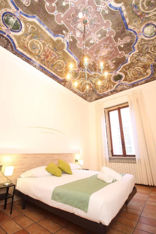 Postel nebo postele na pokoji v ubytování Hotel Tornielli 9 by LVG Hotel Collection