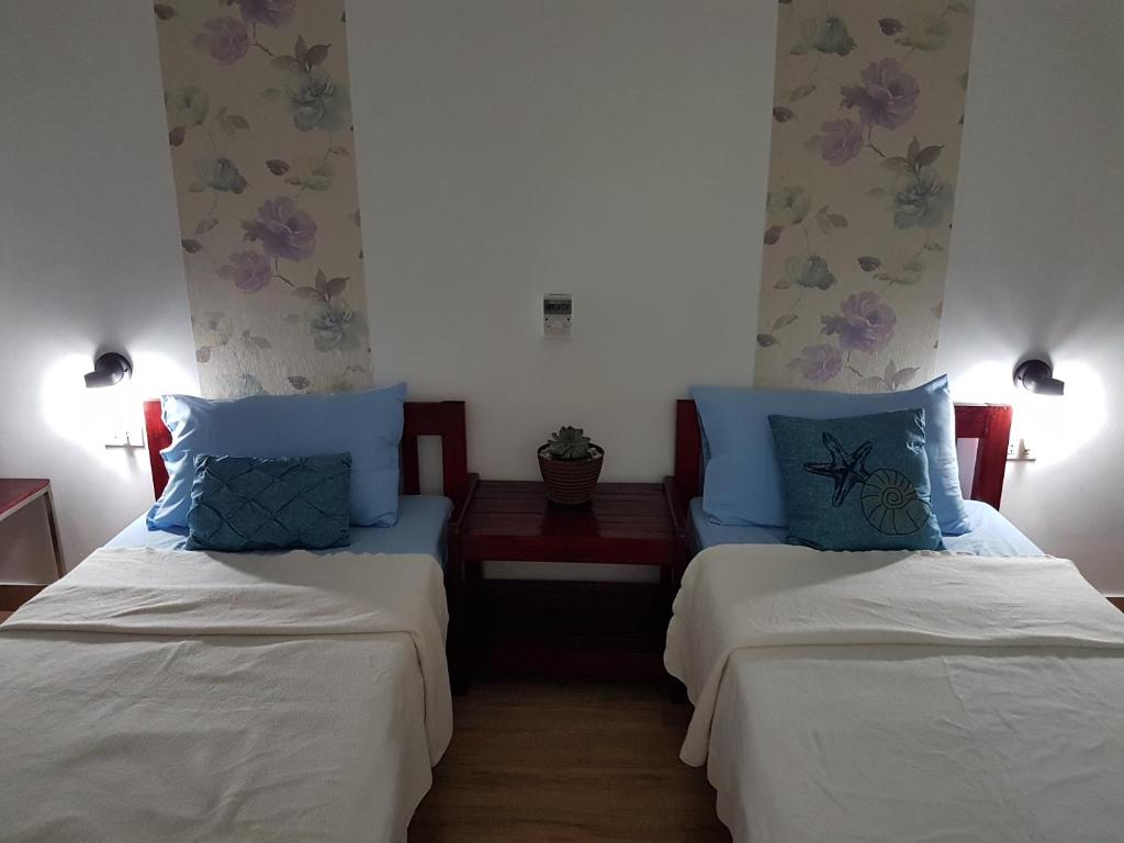 Postel nebo postele na pokoji v ubytování Pentaqua -Dineros Guest House
