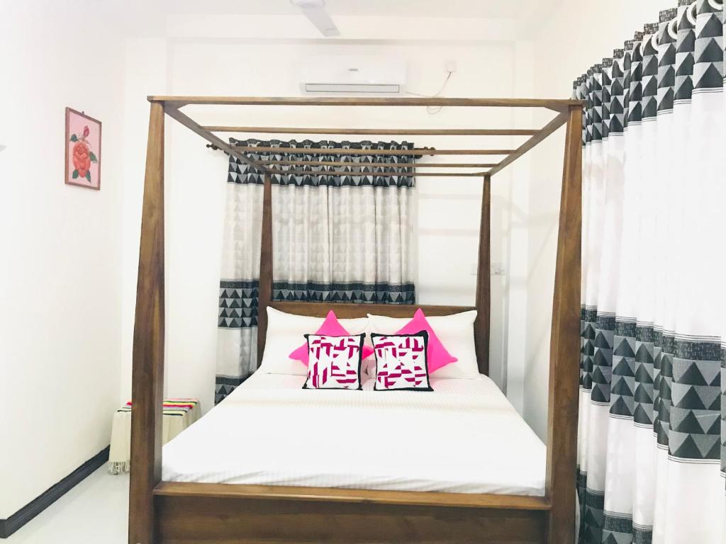 Postel nebo postele na pokoji v ubytování Jilan Homestay