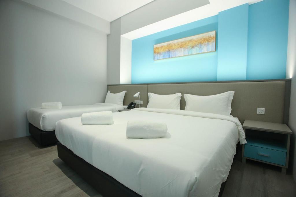 Postel nebo postele na pokoji v ubytování Stanton City Hotel