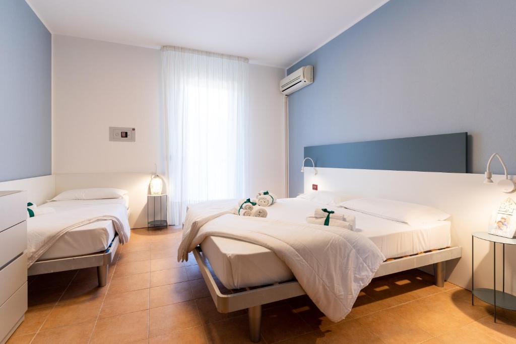 Кровать или кровати в номере Summer Time Family Resort