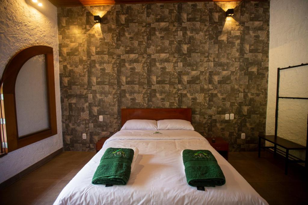 Postel nebo postele na pokoji v ubytování Apu Samay Nature Lodge