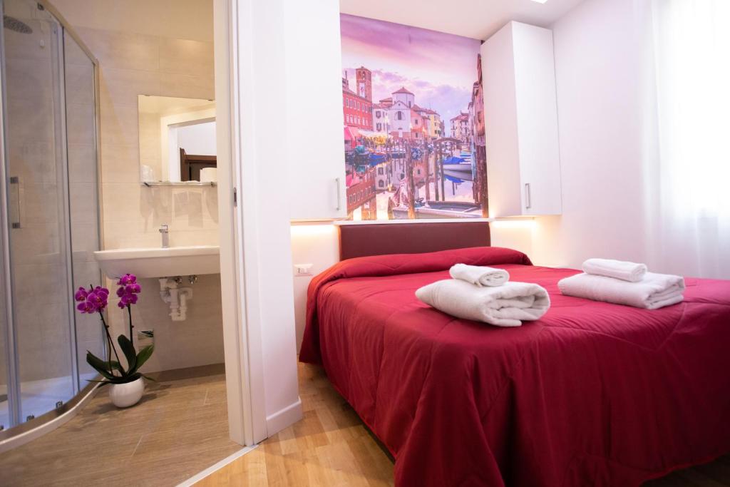 Postel nebo postele na pokoji v ubytování Hotel Ragno D'Oro