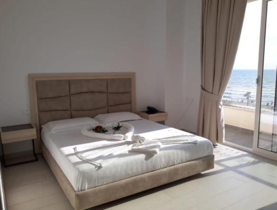Postel nebo postele na pokoji v ubytování BluMare Resort
