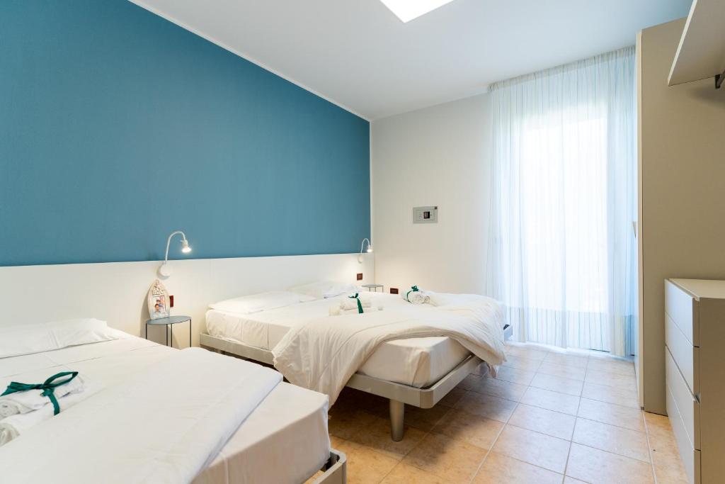Кровать или кровати в номере Summer Time Family Resort