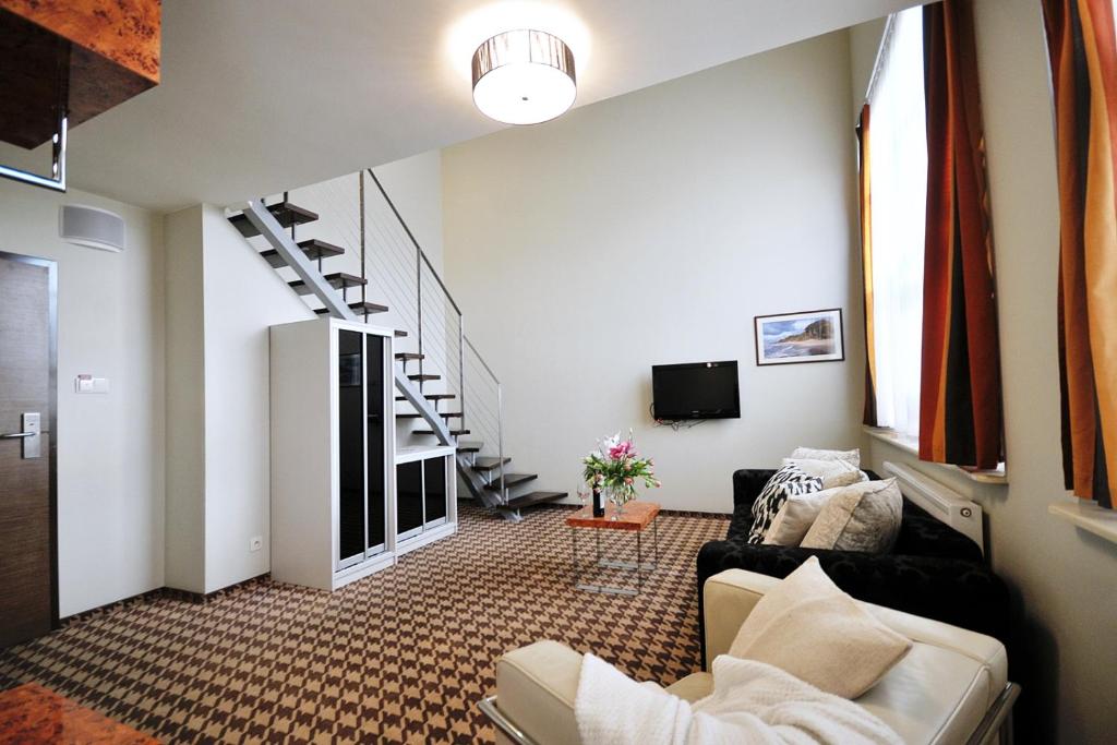 Televízia a/alebo spoločenská miestnosť v ubytovaní 423 w ROYAL TULIP SAND 200 m plaża DOBRUK APARTAMENTY