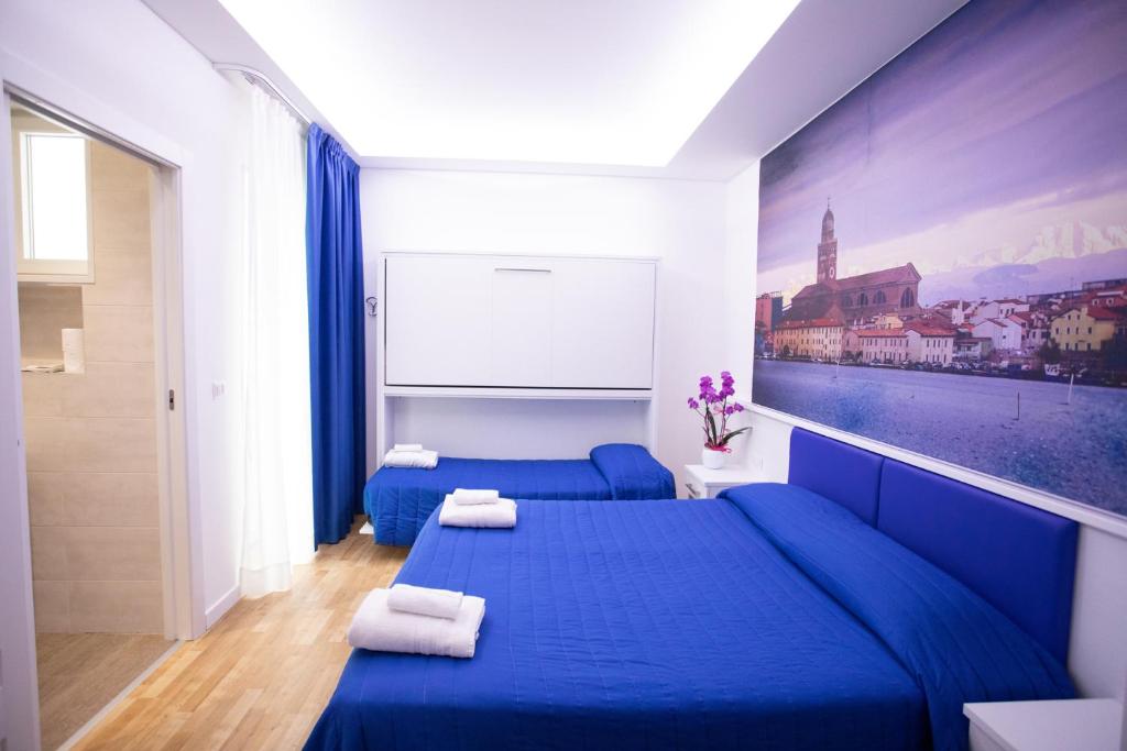 Postel nebo postele na pokoji v ubytování Hotel Ragno D'Oro