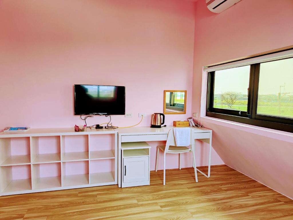 TV a/nebo společenská místnost v ubytování Xinyuanbao Shangshi Homestay