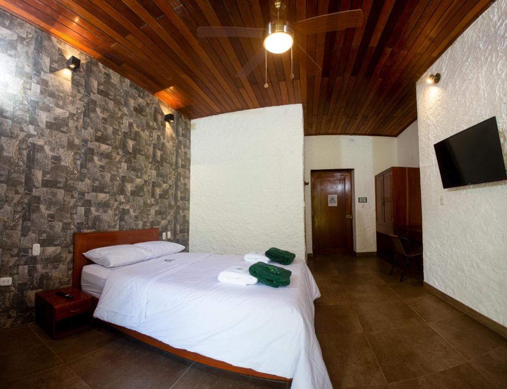 Postel nebo postele na pokoji v ubytování Apu Samay Nature Lodge