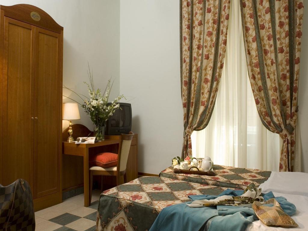 Postel nebo postele na pokoji v ubytování Hotel Aberdeen