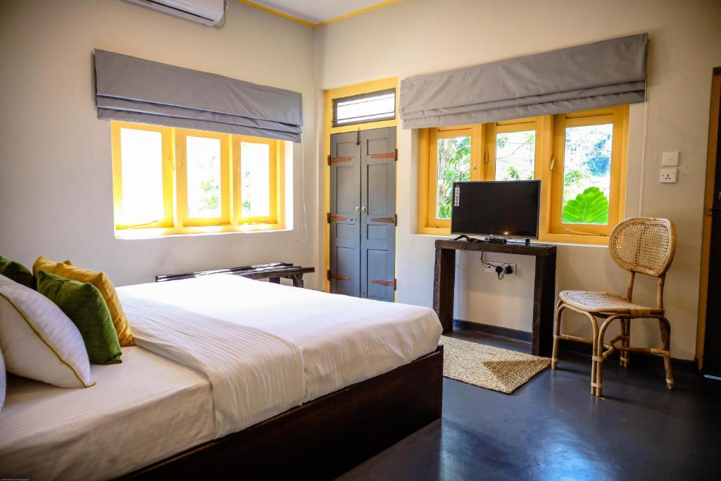 Postel nebo postele na pokoji v ubytování Banana Bunks Kandy