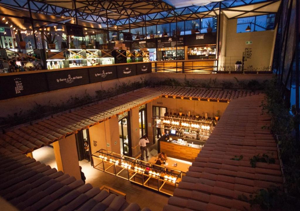 an overhead view of a restaurant with an auditorium at Mexico Hostel in Mexico City