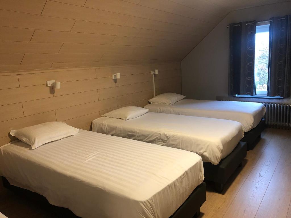 Postel nebo postele na pokoji v ubytování Hotel Oude Abdij