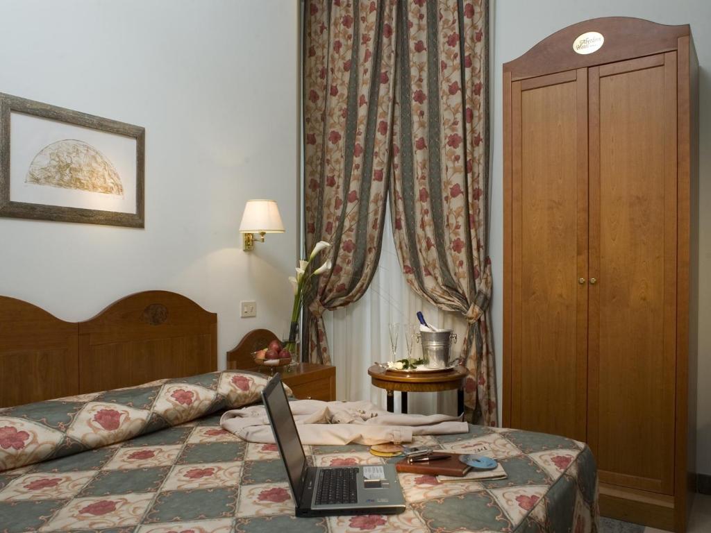 Postel nebo postele na pokoji v ubytování Hotel Aberdeen