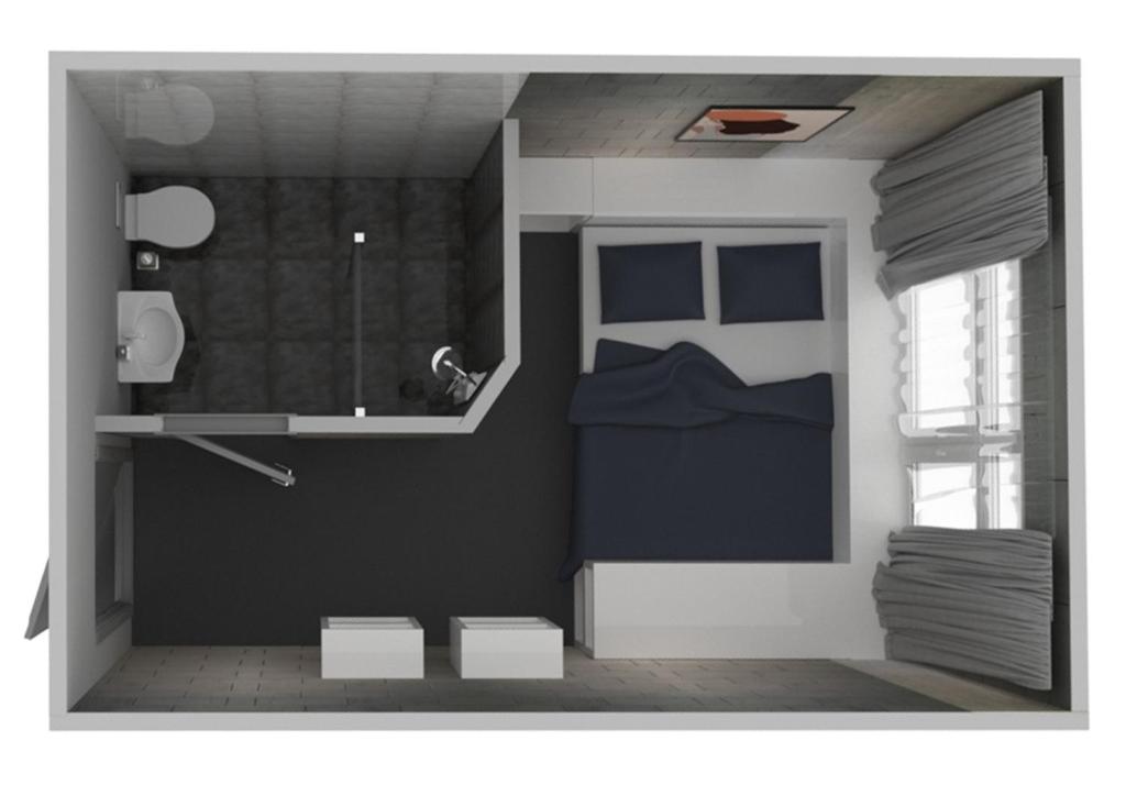 Postel nebo postele na pokoji v ubytování Cubby Hotel