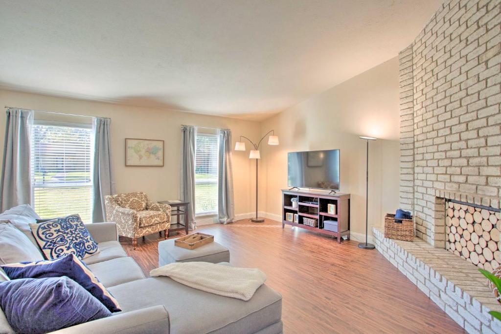 a living room with a couch and a fireplace at Plano Home with Private Yard Less Than 5 Mi to Downtown! in Plano