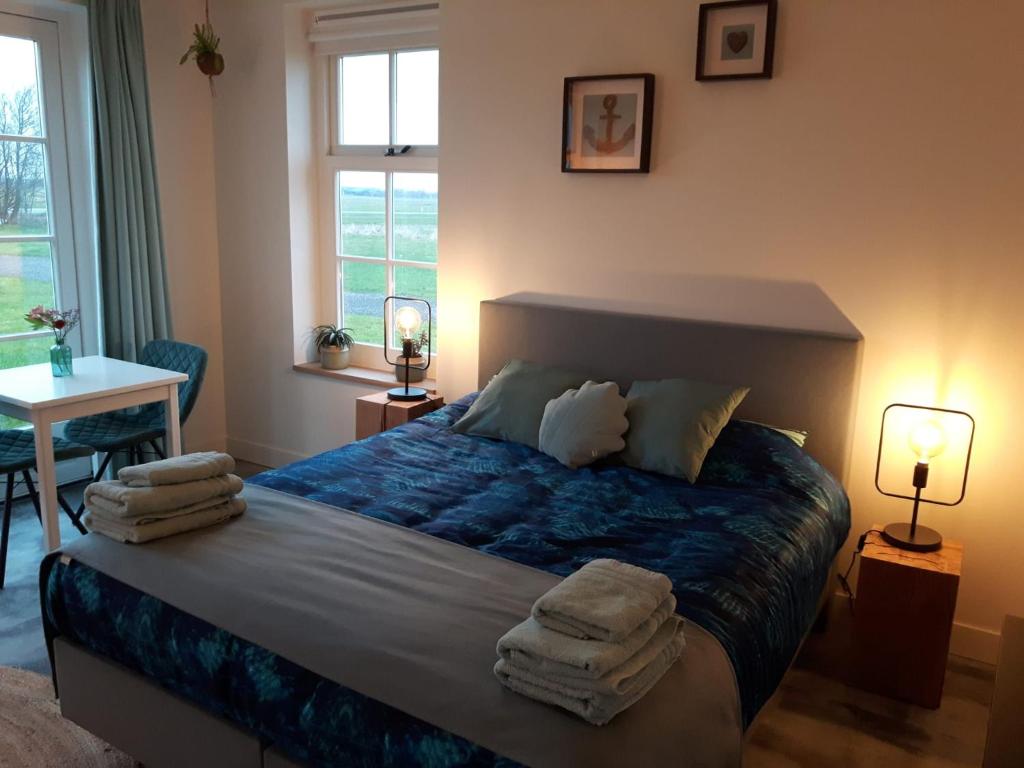 Postel nebo postele na pokoji v ubytování Bed no breakfast de Kapitein