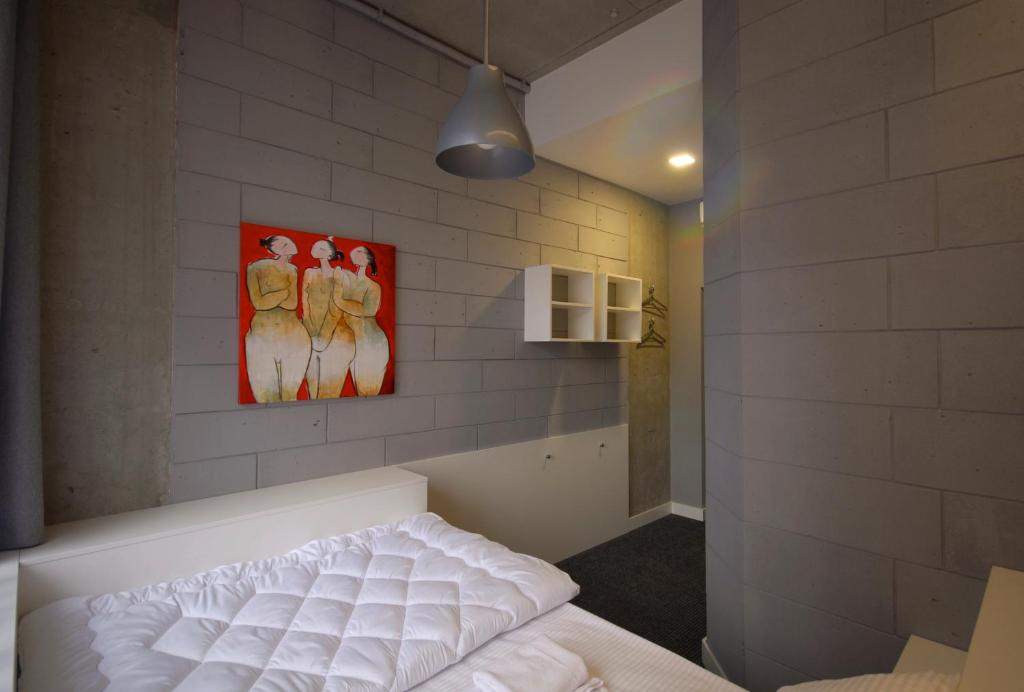 Postel nebo postele na pokoji v ubytování Cubby Hotel