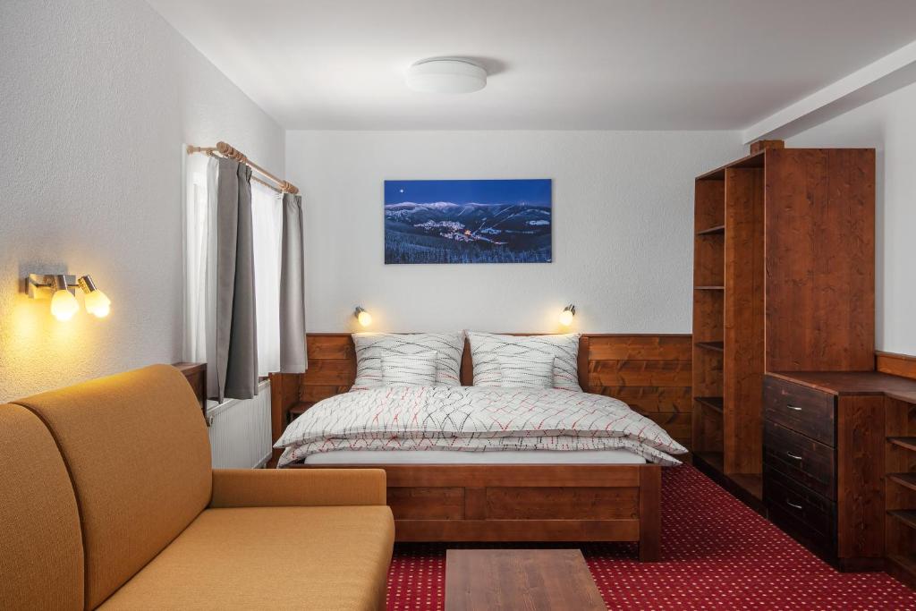Posteľ alebo postele v izbe v ubytovaní U Komárků