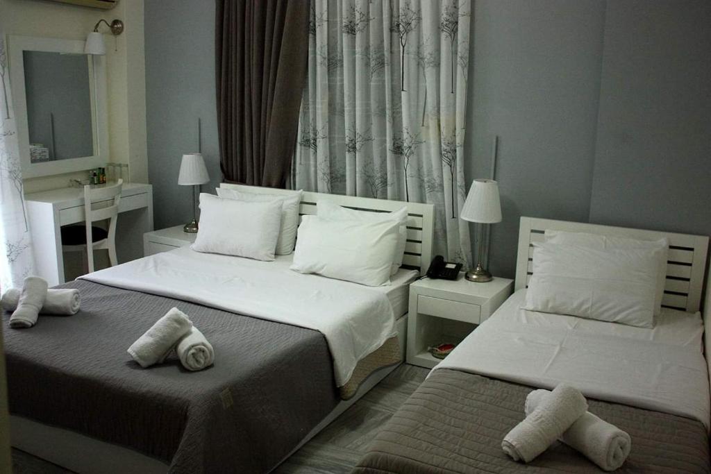 Postel nebo postele na pokoji v ubytování Hotel Galaxidi