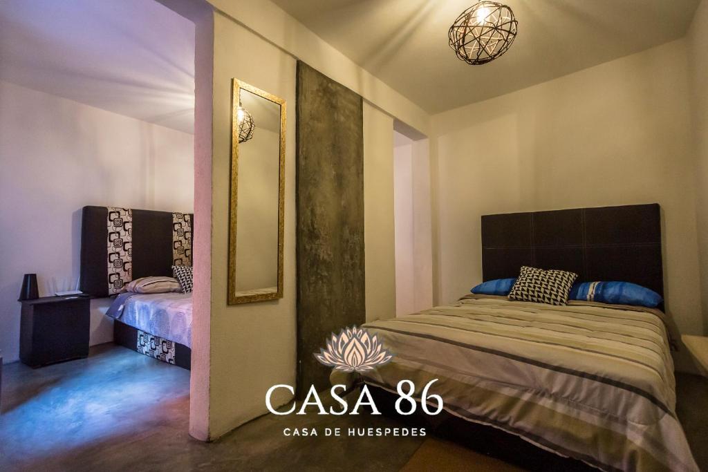 Postel nebo postele na pokoji v ubytování Casa 86