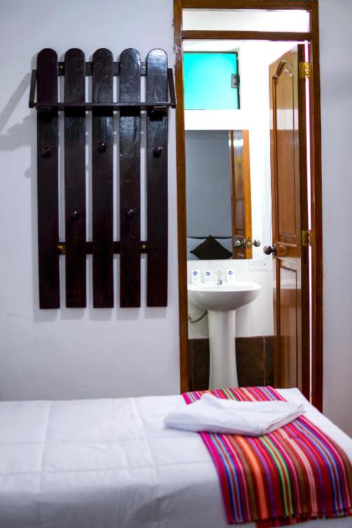 Postel nebo postele na pokoji v ubytování Peru Coca B&B Machupicchu