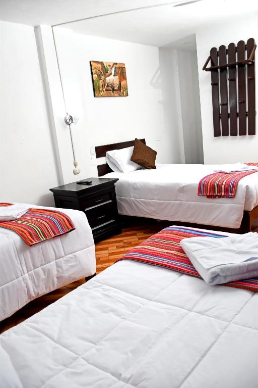 Postel nebo postele na pokoji v ubytování Peru Coca B&B Machupicchu