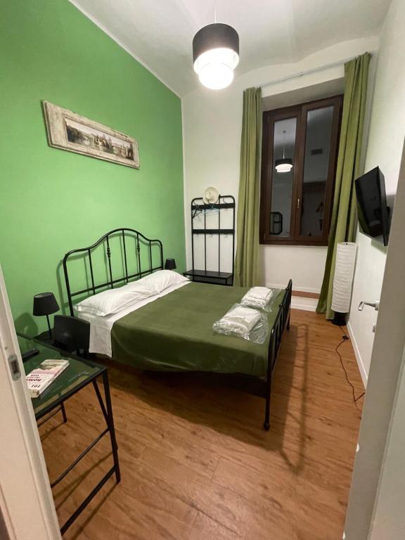 A bed or beds in a room at Appartamento Stazione Termini