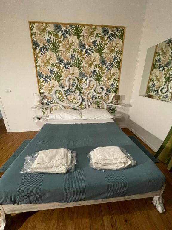 A bed or beds in a room at Appartamento Stazione Termini