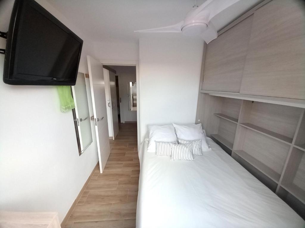 Postel nebo postele na pokoji v ubytování Apartamentos Medano - Lagos de Miramar Deluxe