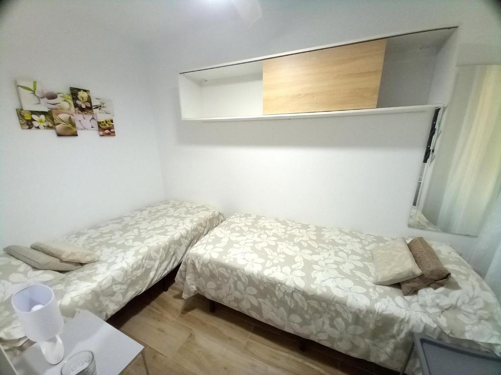 Postel nebo postele na pokoji v ubytování Apartamentos Medano - Lagos de Miramar Deluxe