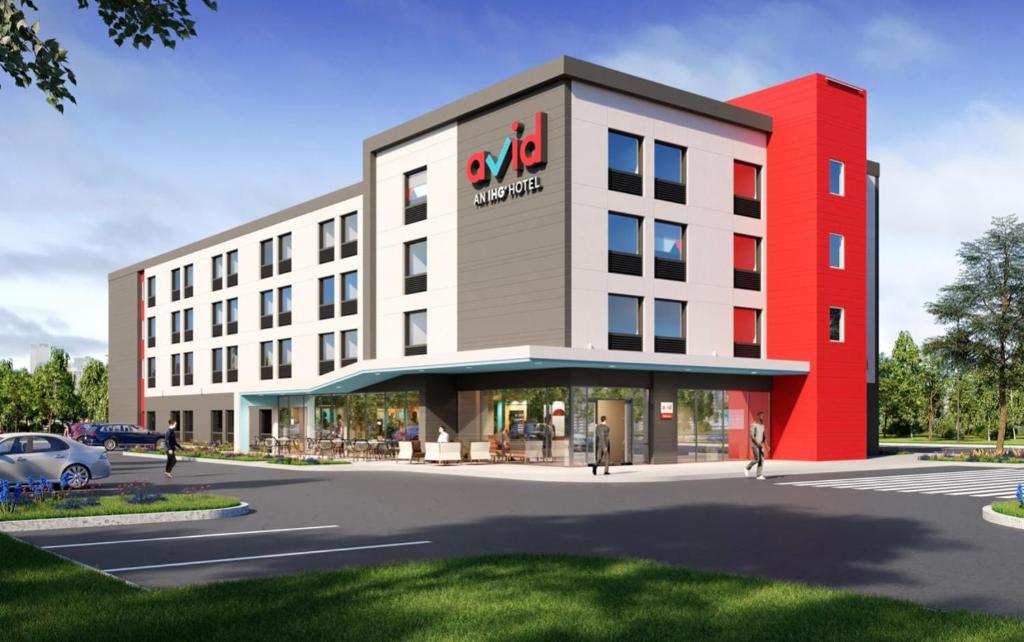 an artists rendering of a hotel planned for the intersection of a street at avid hotels - Macon North, an IHG Hotel in Macon