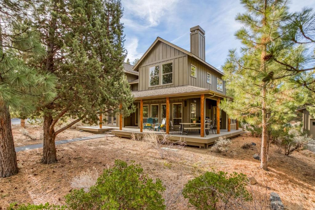 an exterior view of a house with trees at Beautiful Bend Retreat - Meredith Lodging in Bend