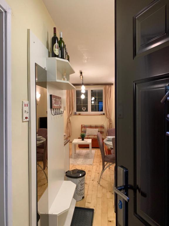 a view of a living room and a dining room at Ski-in & Ski-out, Apartman Filip - 30m from GONDOLA Brzeće in Kopaonik