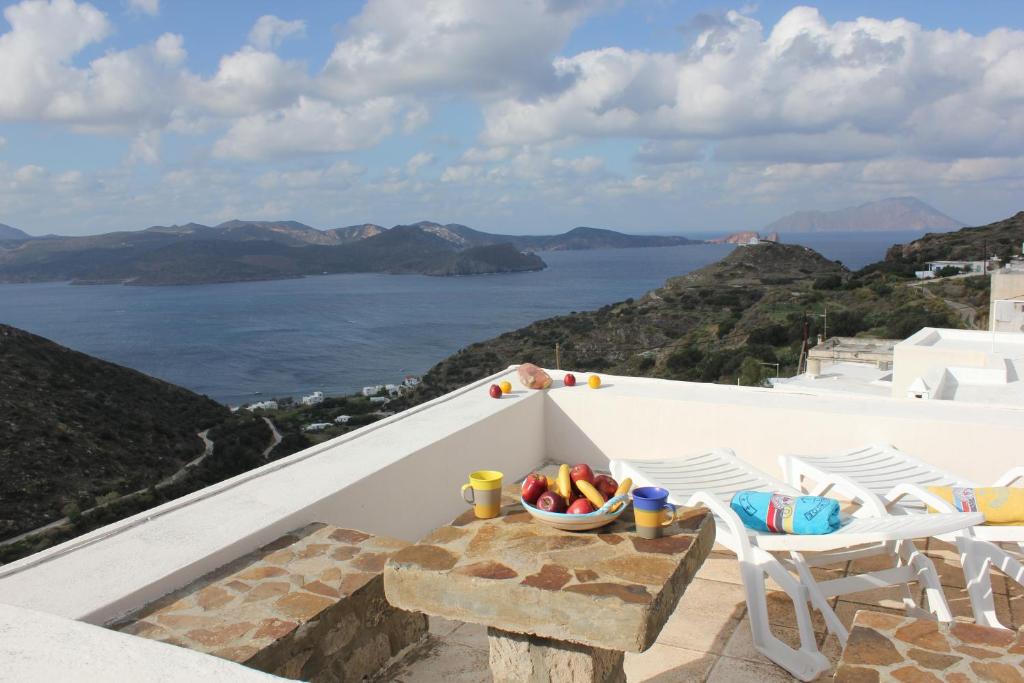 a balcony with a view of the ocean at Efi's Apartments in Plaka Milou