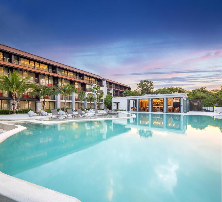 a large swimming pool in front of a building at The Culture Samui in Bangrak Beach