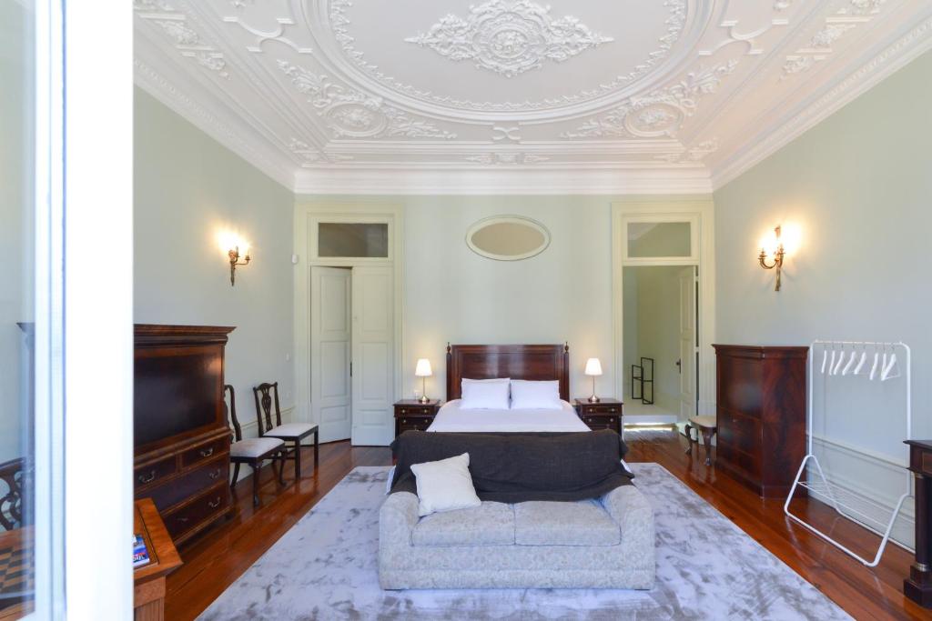 Postel nebo postele na pokoji v ubytování Maison des Amis Porto