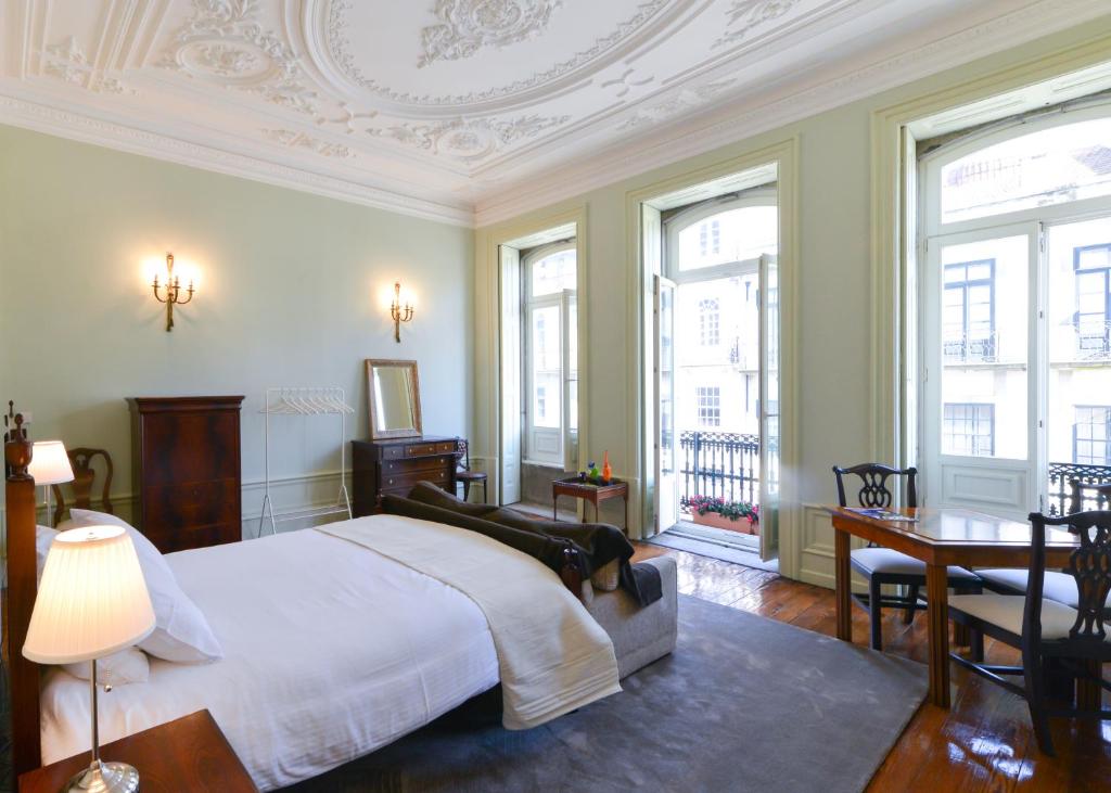 Postel nebo postele na pokoji v ubytování Maison des Amis Porto