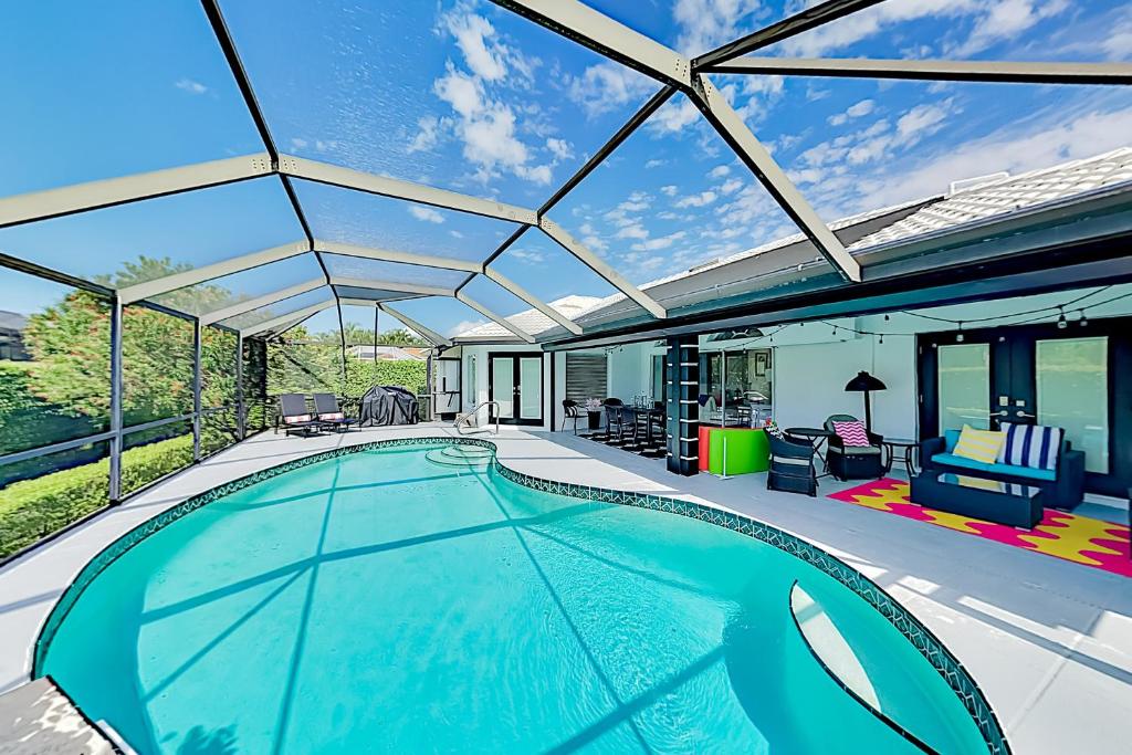 an image of a swimming pool in a house at Chic Beach Haven in Marco Island