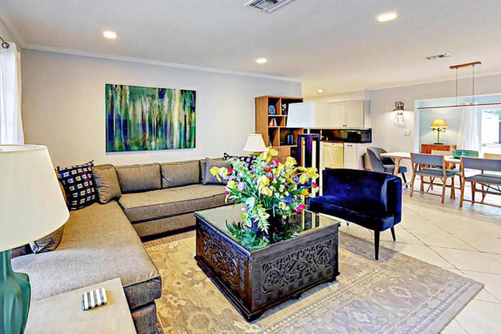 a living room with a couch and a table at Breezy Ocean Escape in Lake Worth