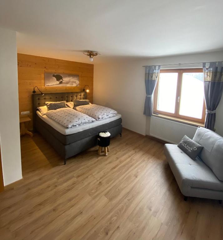 Postel nebo postele na pokoji v ubytování Landhaus Alpenland