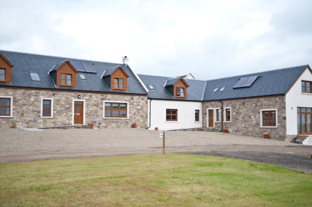 a house with solar panels on the roof at Bamflatt Farm Bed & Breakfast in Strathaven