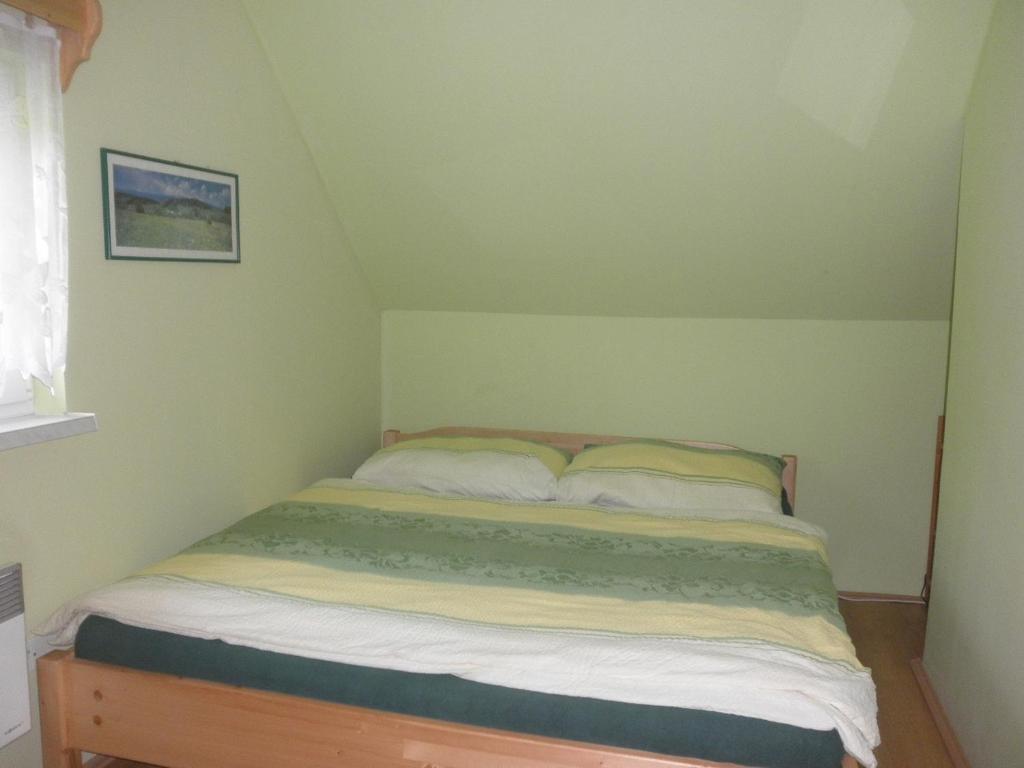 Postel nebo postele na pokoji v ubytování Chaty pod Knížecí, Trojanovice