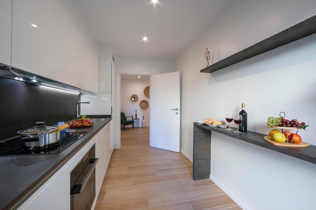 Kuchyň nebo kuchyňský kout v ubytování Boutique Apartments