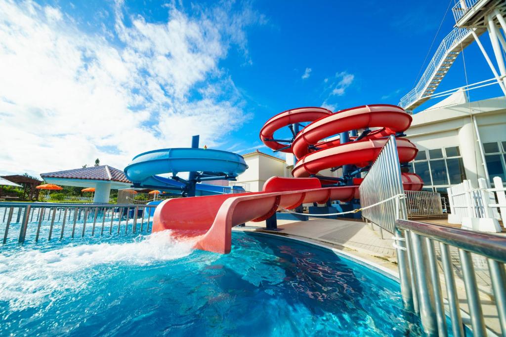 a water slide in a pool at a resort at Sheraton Okinawa Sunmarina Resort in Onna